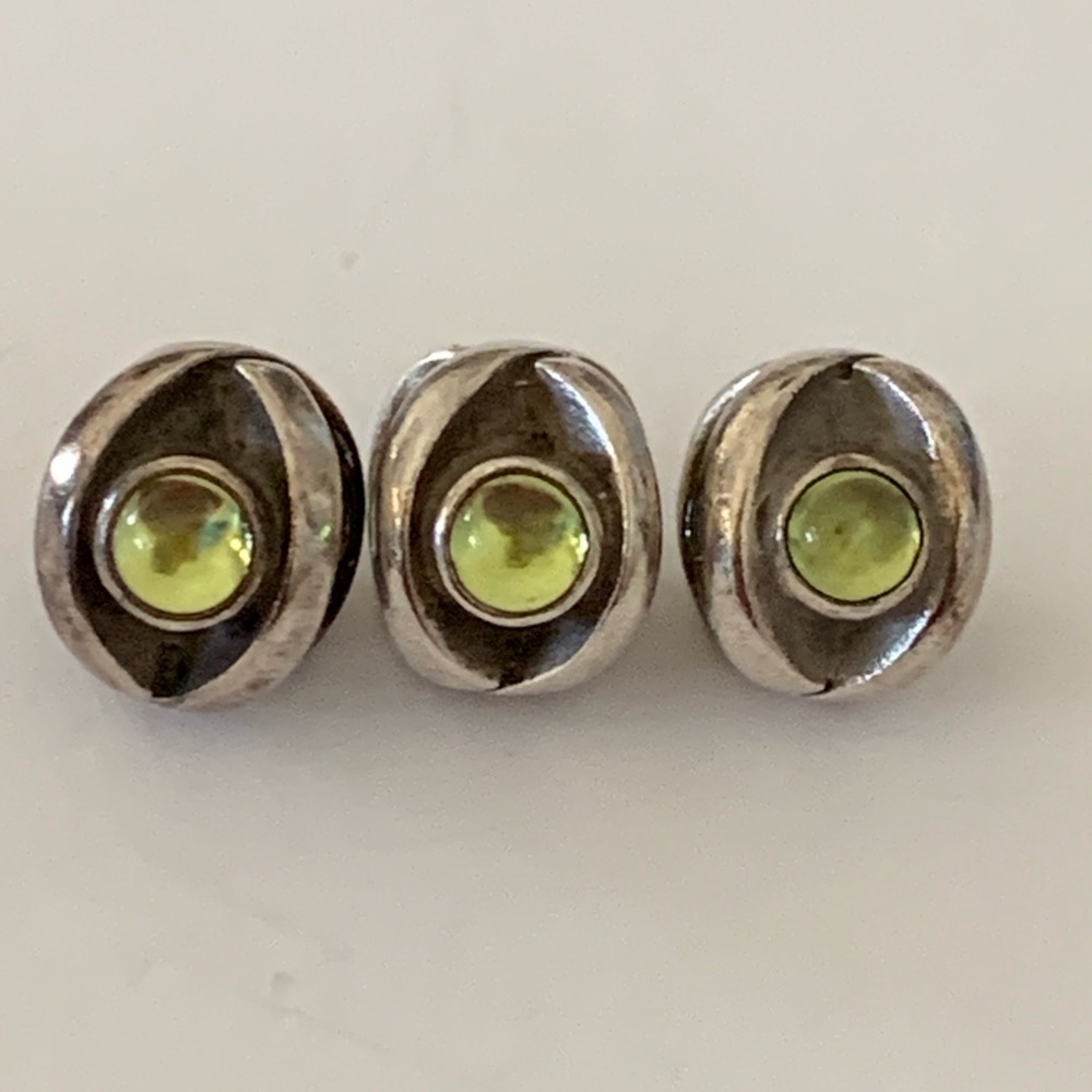 Retired green Pandora peridot eye charms